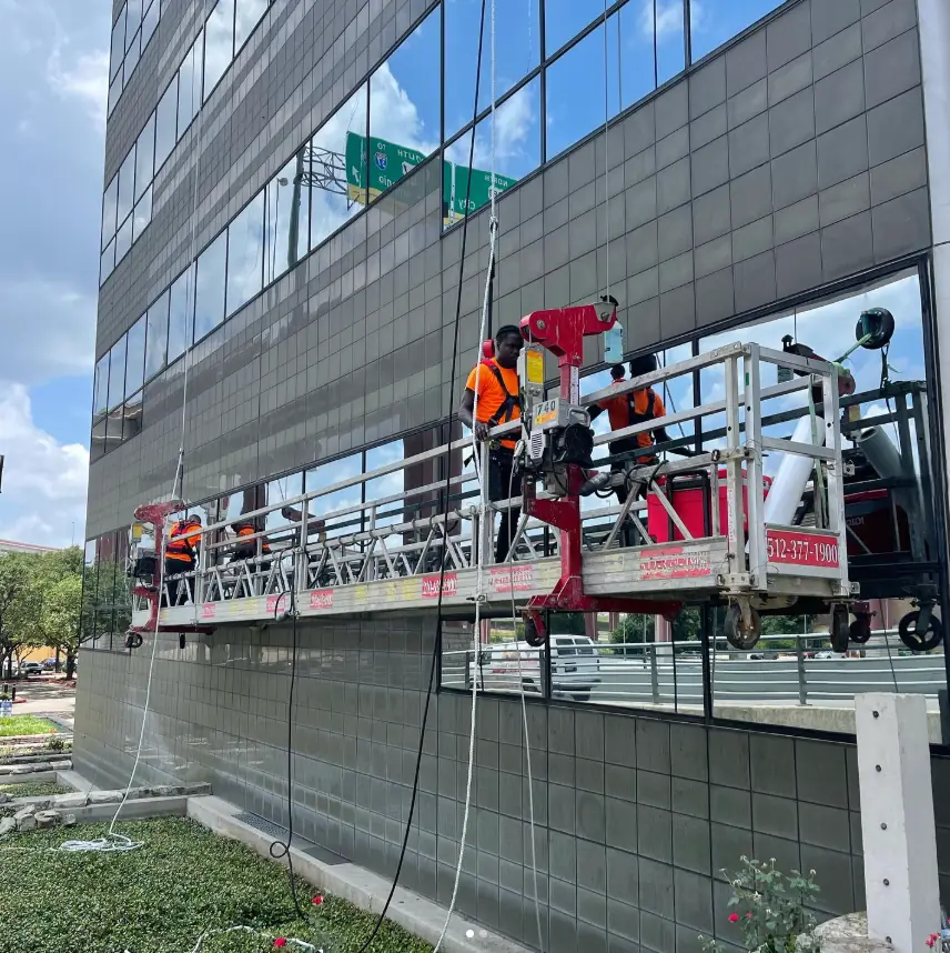 Curtain wall glazing from a boom lift