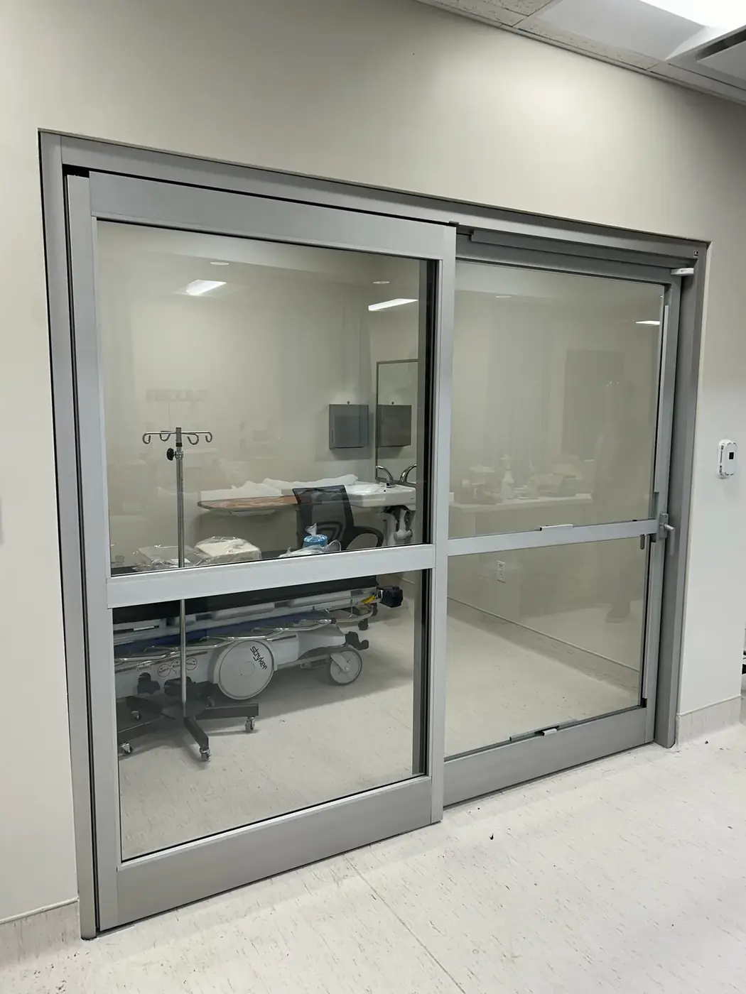 Spine clinic patient room sliding door system, San Antonio
